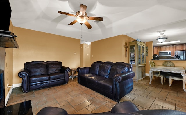 living room featuring ceiling fan