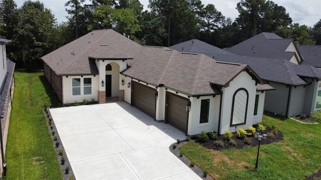 french country inspired facade featuring a front lawn and a garage