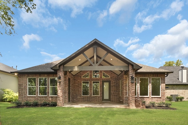 back of house featuring a yard, a patio, and central air condition unit