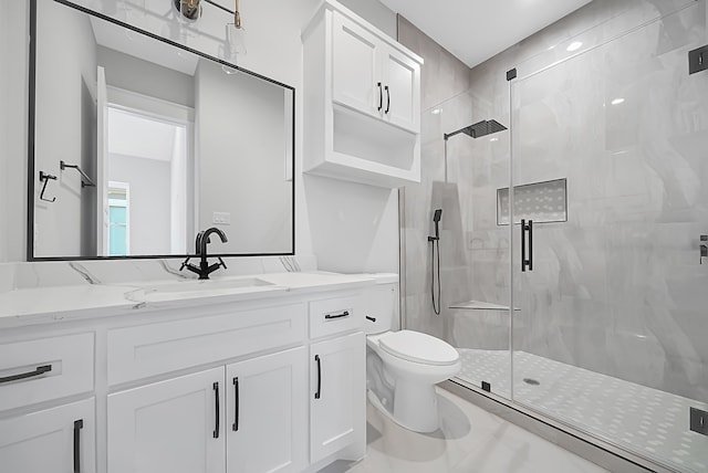 bathroom with vanity, toilet, and walk in shower