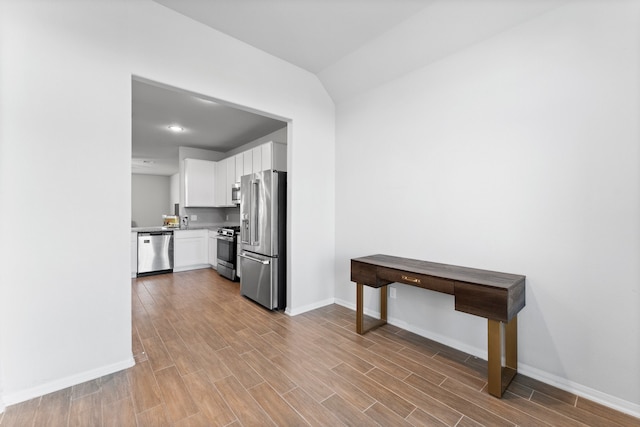 kitchen featuring white cabinets and appliances with stainless steel finishes