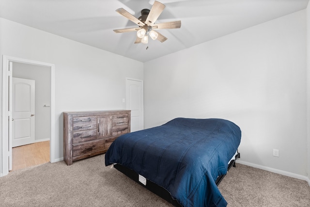 carpeted bedroom featuring ceiling fan