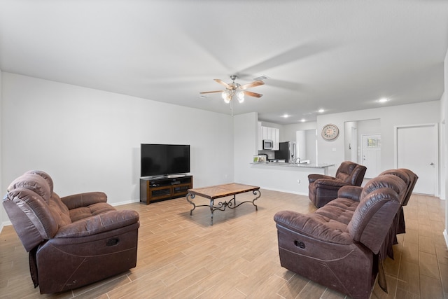 living room featuring ceiling fan