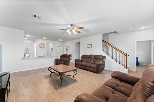 living room with ceiling fan