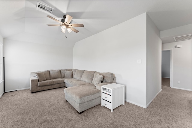 living room with ceiling fan, lofted ceiling, and light carpet