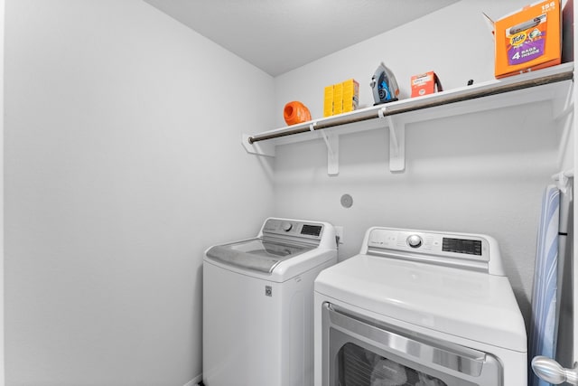 laundry room with separate washer and dryer