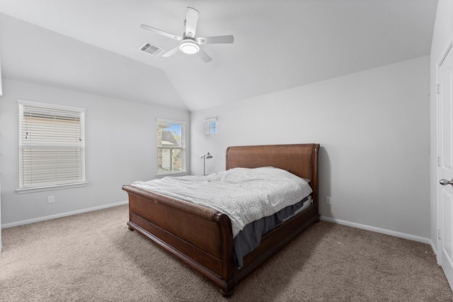 carpeted bedroom featuring ceiling fan and vaulted ceiling