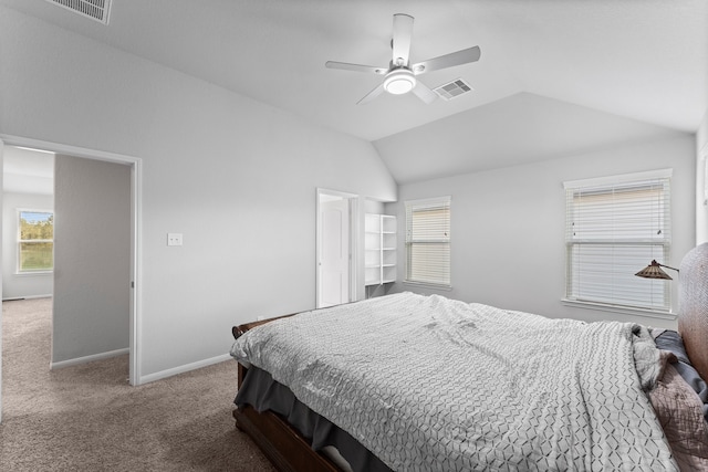 carpeted bedroom featuring vaulted ceiling and ceiling fan