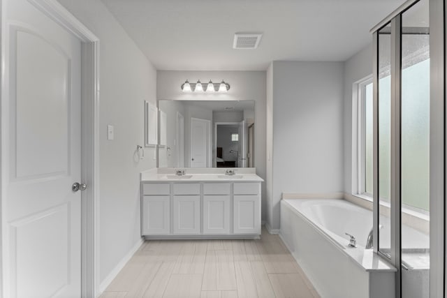 bathroom featuring a bathtub and vanity