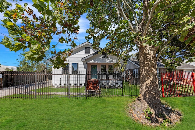 back of house with a yard