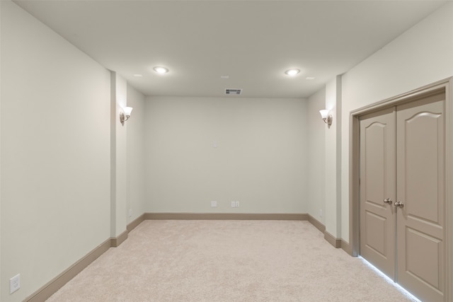 basement with light colored carpet