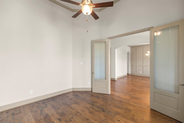 unfurnished room featuring ceiling fan and dark wood-type flooring