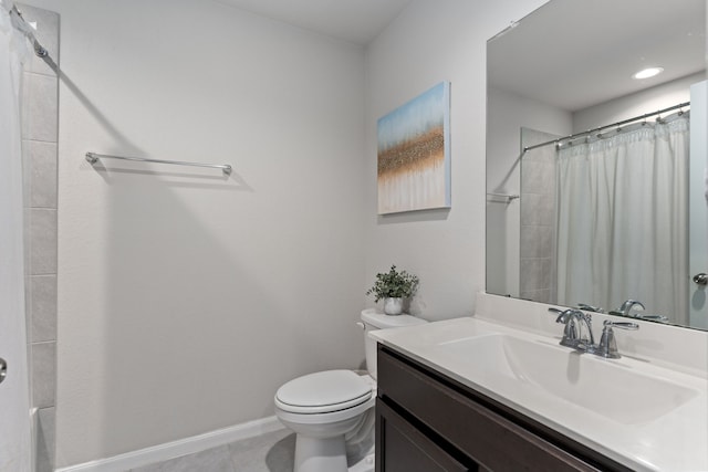 bathroom featuring tile patterned flooring, vanity, toilet, and walk in shower