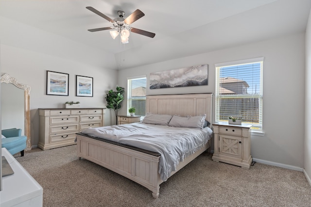 bedroom featuring ceiling fan and light carpet