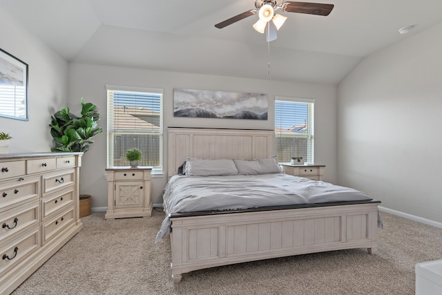 carpeted bedroom with ceiling fan and lofted ceiling