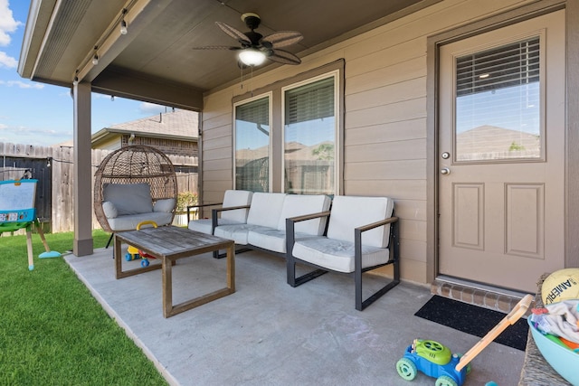 view of patio with outdoor lounge area and ceiling fan