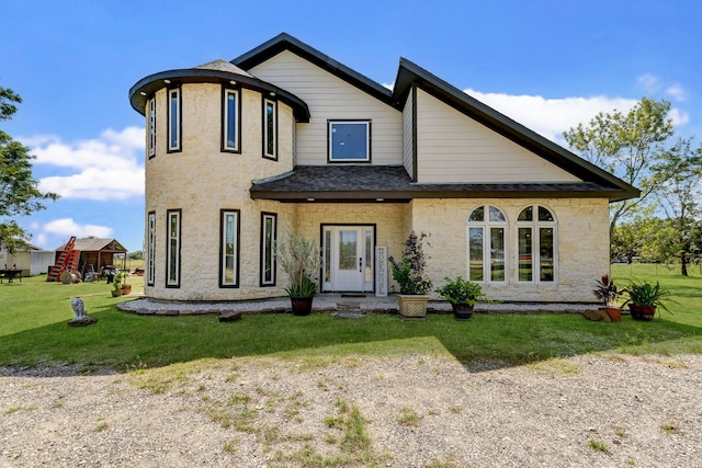 view of front of property with a front lawn and french doors