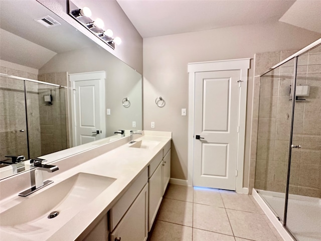 bathroom featuring lofted ceiling, walk in shower, vanity, and tile patterned floors