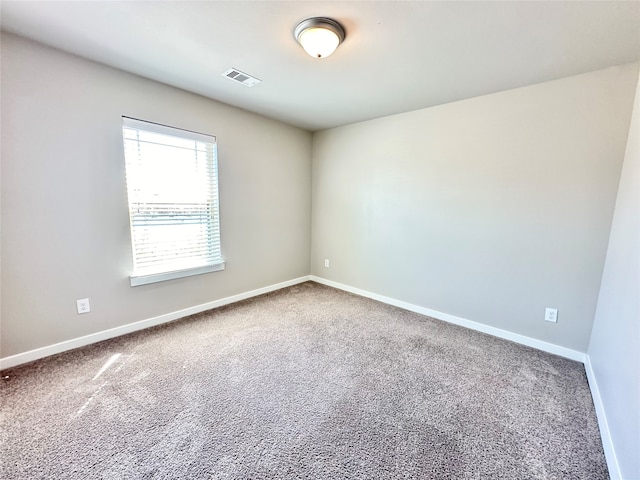 spare room featuring carpet floors