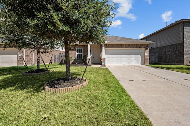 view of front of home with a front yard and a garage