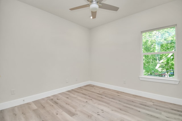 spare room featuring ceiling fan and light wood-type flooring