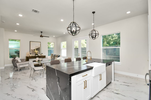 kitchen featuring sink, white cabinetry, decorative light fixtures, a center island with sink, and dishwasher