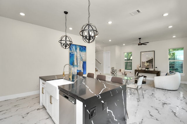 kitchen with white cabinetry, decorative light fixtures, a center island with sink, plenty of natural light, and dishwasher