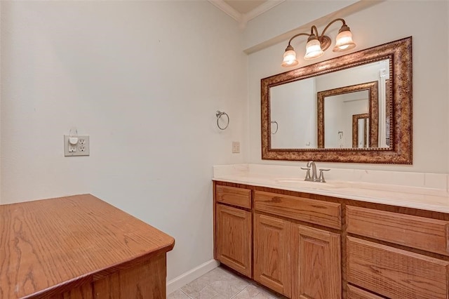 bathroom with tile patterned floors, crown molding, and vanity