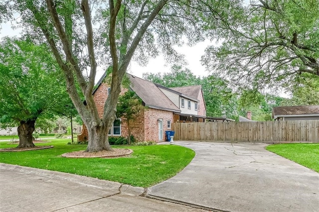 view of property exterior with a yard