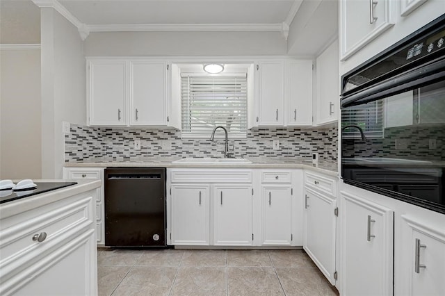 kitchen featuring black appliances, decorative backsplash, sink, and white cabinets