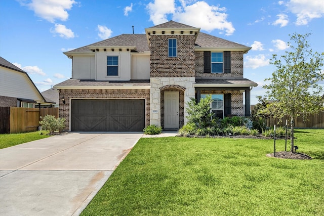 view of front of home featuring a garage and a front lawn