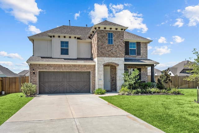 view of front of home with a garage and a front yard