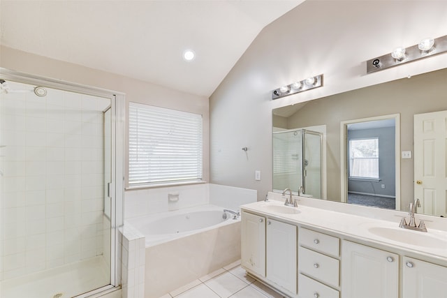 bathroom featuring vanity, shower with separate bathtub, tile patterned flooring, and vaulted ceiling