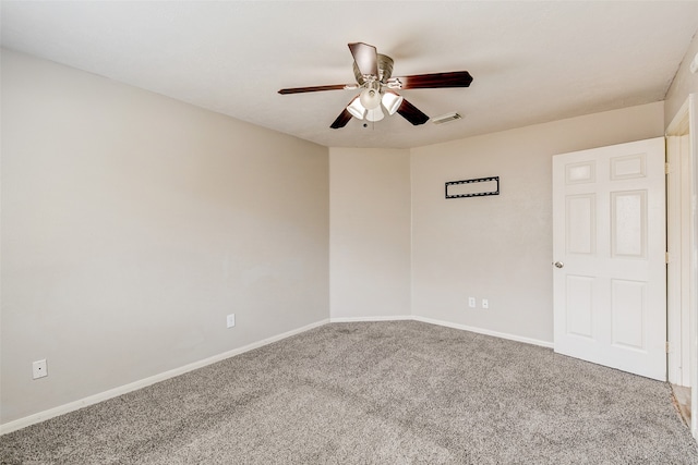 empty room with ceiling fan and carpet