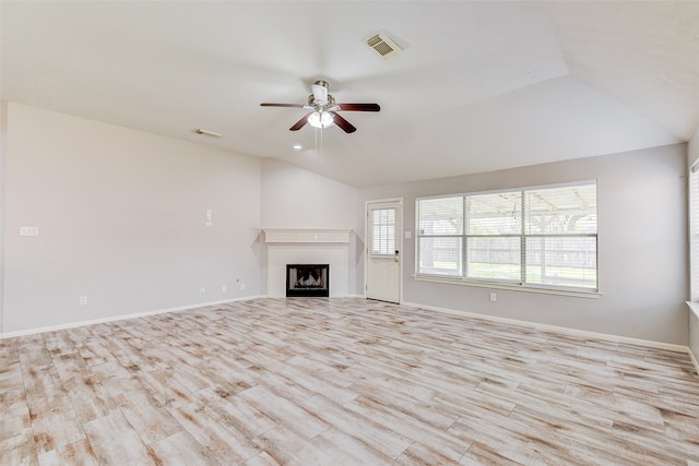 unfurnished living room featuring light hardwood / wood-style flooring, vaulted ceiling, and ceiling fan