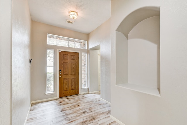 foyer entrance featuring light hardwood / wood-style flooring