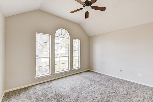 carpeted empty room featuring lofted ceiling and ceiling fan