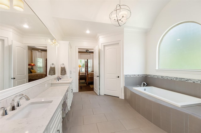 bathroom with lofted ceiling, vanity, ornamental molding, a relaxing tiled tub, and tile patterned floors