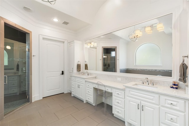 bathroom with ornamental molding, vanity, a shower with door, and tile patterned floors