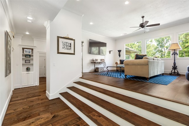 living room with dark wood-style floors, recessed lighting, and crown molding