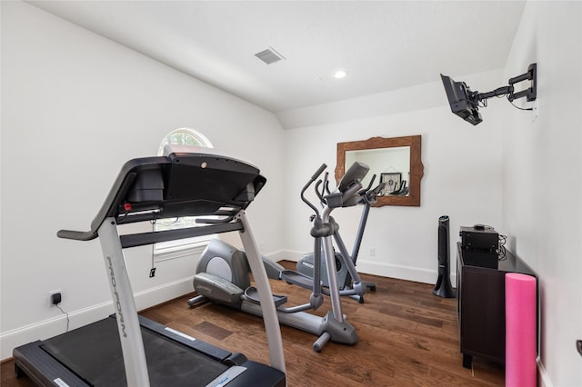 workout room with recessed lighting, lofted ceiling, visible vents, wood finished floors, and baseboards