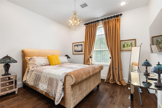 bedroom featuring baseboards, a notable chandelier, visible vents, and wood finished floors