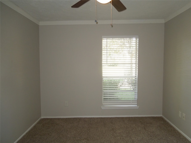 carpeted spare room with a textured ceiling, ornamental molding, and ceiling fan