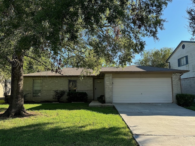 ranch-style home with a front yard and a garage