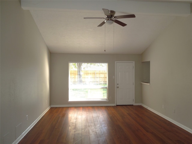 empty room with vaulted ceiling with beams, dark hardwood / wood-style flooring, and ceiling fan