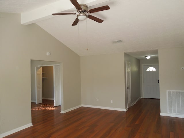 unfurnished room with ceiling fan, a textured ceiling, lofted ceiling with beams, and dark hardwood / wood-style flooring