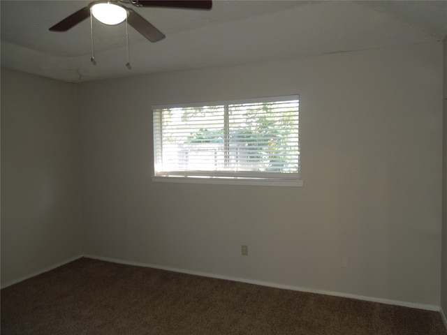 unfurnished room with ceiling fan and carpet flooring