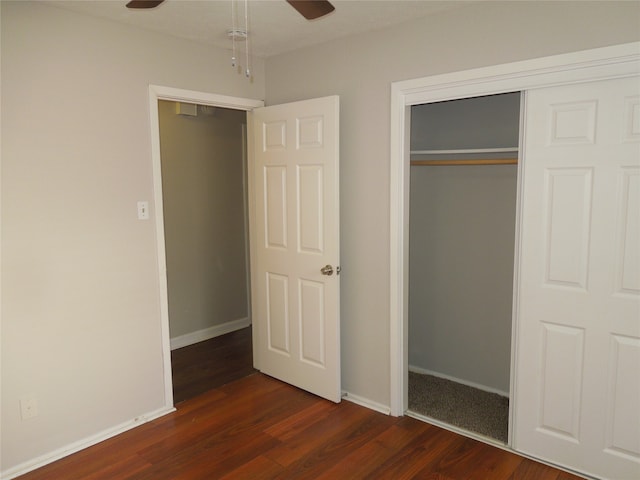 interior space featuring ceiling fan, a closet, and dark hardwood / wood-style floors