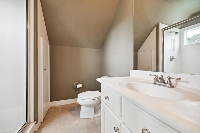 bathroom featuring vaulted ceiling, a shower with door, vanity, and toilet