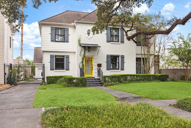 view of front of home with a front lawn